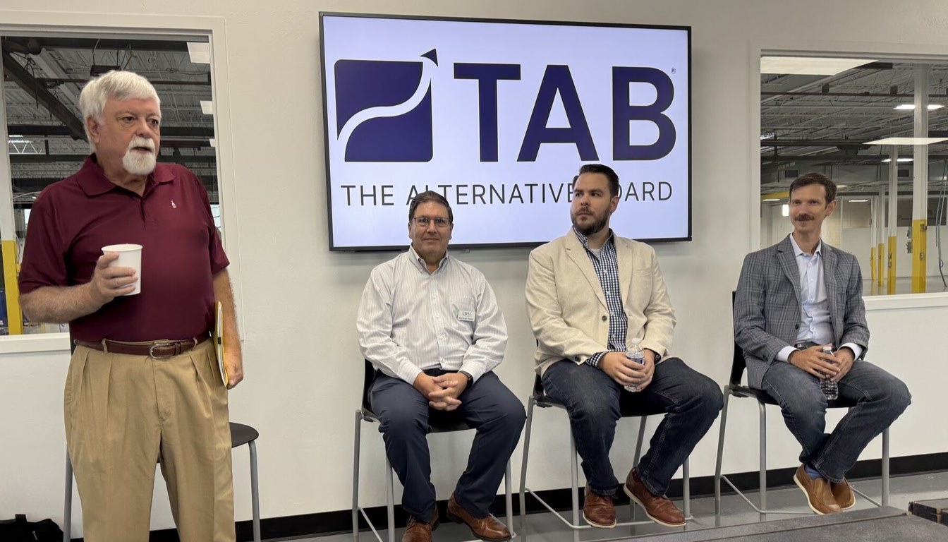 Kenn speaking on a panel at The Alternative Board